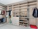 Custom-designed walk-in closet with abundant shelving at 4651 Gulf Of Mexico Dr # 402, Longboat Key, FL 34228
