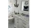Nicely decorated bathroom with marble countertop vanity, and charming nautical décor accents at 6006 Hibiscus Dr # 6006, Bradenton, FL 34207