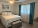 Bright bedroom with a queen-sized bed, a serene atmosphere, and neutral décor at 6006 Hibiscus Dr # 6006, Bradenton, FL 34207