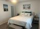 Bright bedroom featuring neutral decor and a comfortably sized bed with ample pillows at 6006 Hibiscus Dr # 6006, Bradenton, FL 34207