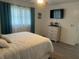 Cozy bedroom featuring neutral tones and a comfortable bed with ample pillows and natural light at 6006 Hibiscus Dr # 6006, Bradenton, FL 34207