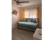 Inviting bedroom featuring a cozy daybed and a cheerful, vibrant ambiance at 6006 Hibiscus Dr # 6006, Bradenton, FL 34207