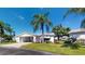 Charming single-story home with well-manicured lawn, mature landscaping, and convenient covered parking at 6006 Hibiscus Dr # 6006, Bradenton, FL 34207