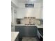 Charming kitchen with white cabinets and stylish grey lower cabinets at 6006 Hibiscus Dr # 6006, Bradenton, FL 34207