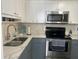 Well-lit kitchen featuring stainless steel appliances and marble countertops at 6006 Hibiscus Dr # 6006, Bradenton, FL 34207