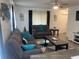 Comfortable living room featuring a plush grey sofa and a cozy loveseat at 6006 Hibiscus Dr # 6006, Bradenton, FL 34207