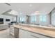 Modern kitchen with island and city views at 800 N Tamiami Trl # 1603, Sarasota, FL 34236