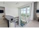 Modern loft area with expansive windows offering stunning water views at 800 N Tamiami Trl # 1603, Sarasota, FL 34236