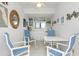 Bright and airy community room with tables and chairs at 800 N Tamiami Trl # 1603, Sarasota, FL 34236