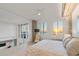 Spacious main bedroom with sunset views and a sitting area at 800 N Tamiami Trl # 1603, Sarasota, FL 34236