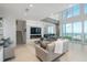 Spacious living room features floor-to-ceiling windows and city views at 800 N Tamiami Trl # 1603, Sarasota, FL 34236
