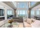 Spacious living room with high ceilings and water views at 800 N Tamiami Trl # 1603, Sarasota, FL 34236