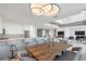 Modern dining area with a live edge table and kitchen views at 800 N Tamiami Trl # 1603, Sarasota, FL 34236