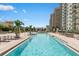 Resort-style pool with plenty of lounge chairs at 800 N Tamiami Trl # 1603, Sarasota, FL 34236