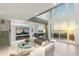 Elegant living room with sunset views and fireplace at 800 N Tamiami Trl # 1603, Sarasota, FL 34236