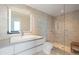 Modern bathroom with a large shower and modern vanity at 800 N Tamiami Trl # 1603, Sarasota, FL 34236