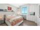 Spacious bedroom with built-in desk and water views at 800 N Tamiami Trl # 1603, Sarasota, FL 34236