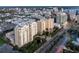 Aerial view of a condo building with a pool and fountain at 800 N Tamiami Trl # 1603, Sarasota, FL 34236