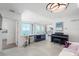 Bright living room with city views, a grand piano, and comfortable seating at 800 N Tamiami Trl # 1603, Sarasota, FL 34236