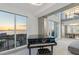 Spacious living area with grand piano and water views at 800 N Tamiami Trl # 1603, Sarasota, FL 34236