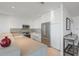 Modern white kitchen with stainless steel appliances at 800 N Tamiami Trl # 1603, Sarasota, FL 34236
