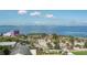 Aerial view shows expansive water views and nearby park at 800 N Tamiami Trl # 1603, Sarasota, FL 34236