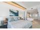 Main bedroom with a large bed and en-suite bathroom at 800 N Tamiami Trl # 1603, Sarasota, FL 34236