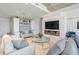 Open living area with built-in shelving, fireplace, and comfortable seating at 800 N Tamiami Trl # 1603, Sarasota, FL 34236