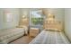 Guest bedroom with twin beds, nightstands and window views at 9320 Clubside Cir # 2109, Sarasota, FL 34238