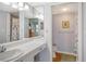 Bathroom features a single sink vanity, shower/tub combo, and updated fixtures at 9320 Clubside Cir # 2109, Sarasota, FL 34238
