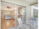 Private patio with table and chairs, view of living room at 9320 Clubside Cir # 2109, Sarasota, FL 34238