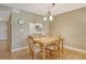 Small dining area with wooden table and chairs, kitchen view at 9320 Clubside Cir # 2109, Sarasota, FL 34238