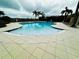 Inviting kidney shaped community pool with plenty of lounge chairs at 9869 Haze Dr, Venice, FL 34292