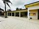 Community pool area with covered seating and tables at 9869 Haze Dr, Venice, FL 34292