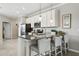 Modern kitchen with stainless steel appliances and granite countertops at 9869 Haze Dr, Venice, FL 34292