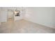 Dining room features tile floors and view into kitchen and entryway at 4260 Central Sarasota Pkwy # 213, Sarasota, FL 34238