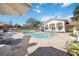 Inviting community pool with patio furniture and lush greenery at 4260 Central Sarasota Pkwy # 213, Sarasota, FL 34238