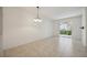 Bright dining room with tile floors and sliding glass doors leading to a patio at 4260 Central Sarasota Pkwy # 213, Sarasota, FL 34238