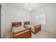 Bedroom with twin beds and window with shutters at 4260 Central Sarasota Pkwy # 213, Sarasota, FL 34238