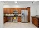 Modern kitchen with stainless steel appliances and wood cabinets at 4260 Central Sarasota Pkwy # 213, Sarasota, FL 34238