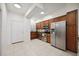 Modern kitchen with stainless steel appliances and wood cabinets at 4260 Central Sarasota Pkwy # 213, Sarasota, FL 34238