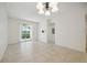 Bright dining room with tile floors and sliding glass doors leading to a patio at 4260 Central Sarasota Pkwy # 213, Sarasota, FL 34238