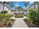 Community courtyard with lush landscaping, fountain, and walking paths at 4260 Central Sarasota Pkwy # 213, Sarasota, FL 34238