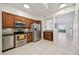 Modern kitchen with stainless steel appliances and wood cabinets at 4260 Central Sarasota Pkwy # 213, Sarasota, FL 34238