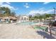 Relaxing pool area with spa and plenty of lounge chairs at 4260 Central Sarasota Pkwy # 213, Sarasota, FL 34238