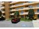 Tan multi-story building with parking and landscaping at 4550 Pinebrook Cir # 103, Bradenton, FL 34209