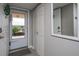 Bright condo entryway with storage closet and mirror at 4550 Pinebrook Cir # 103, Bradenton, FL 34209