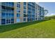 Building exterior showcasing manicured lawn at 4550 Pinebrook Cir # 103, Bradenton, FL 34209