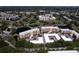 Aerial view of condo community with multiple buildings, lush landscaping, and a golf course at 4550 Pinebrook Cir # 103, Bradenton, FL 34209