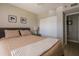 Bedroom with king-size bed, dresser, and sliding door to closet at 4550 Pinebrook Cir # 103, Bradenton, FL 34209